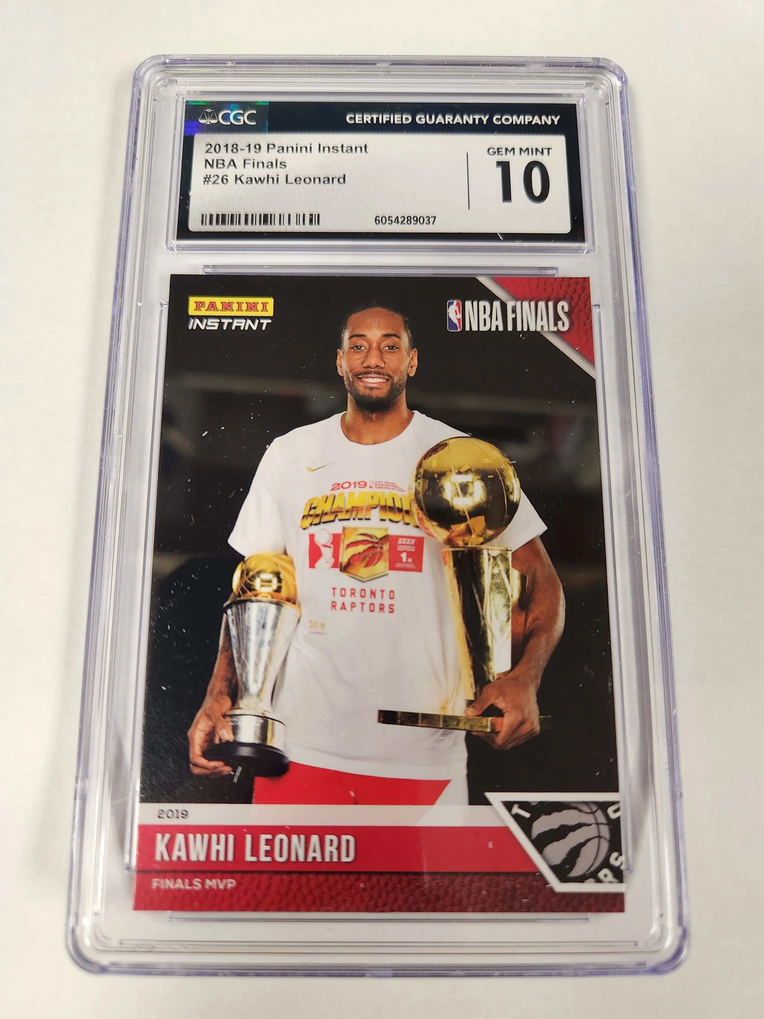 2018 Panini Instant NBA Finals #26 Kawhi Leonard Finals MVP with the Larry O'Brien Trophy Toronto Raptors Champion CGC Graded 10 GEM MINT